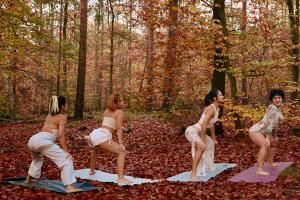 Four People dancing in the forest