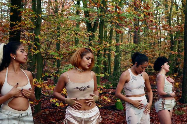 Four people touching themselves in the forest